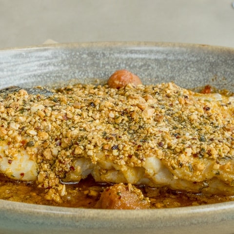 Hake baked with almonds and potato