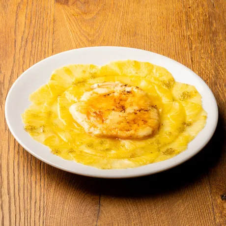 Pineapple carpaccio with catalan cream